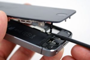 An iPhone being taken apart to replace the battery
