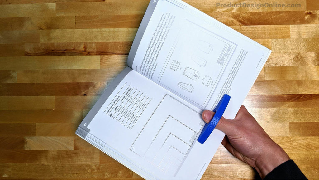 A 3D Printed One-Hand Book holder makes it easier to hold a book with one hand.