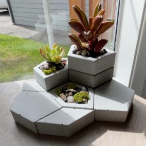 Modular concrete planters created from 3D printed prototypes and silicone molds